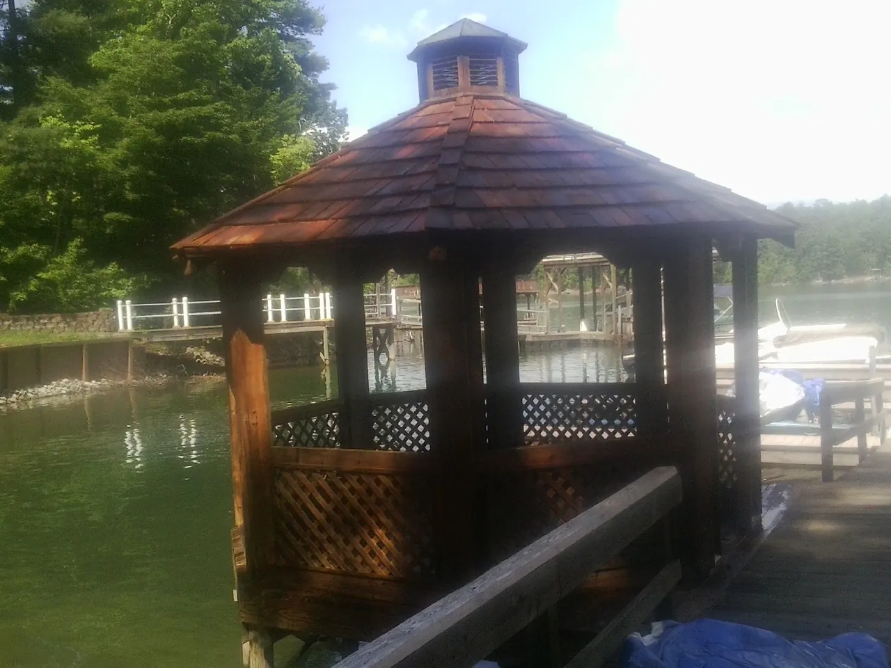 Cedar shake gazebo roof rebuilt on a lake dock in Lake Zurich